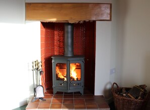 Thairn Cottage has a wood burning stove plenty of homegrown dried wood.