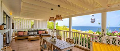 Enjoy spectacular views of the Caribbean Sea from the comfortable porch