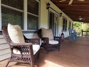 Plenty of front porch seating with mountain view.