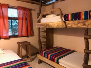 Comfy bunkrooms sleeps three, with custom-made furniture.