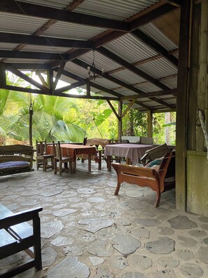 Multiple hammocks, couches to sit while enjoiying breeze and sound of river 