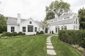 Beautiful stone steps, guided by modern lighting accents lead to entrance. 