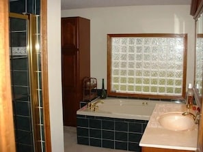 Relax in the wirlpool tub or large shower