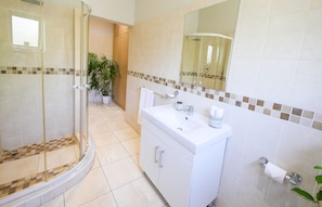 Main Bathroom with bath tub and shower off the bedroom 