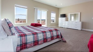 Plan on getting a great night’s sleep at Casa Cassidy! The main master bedroom offers a plush king bed, Smart TV, sliding glass door to the back patio, and an ensuite bathroom.