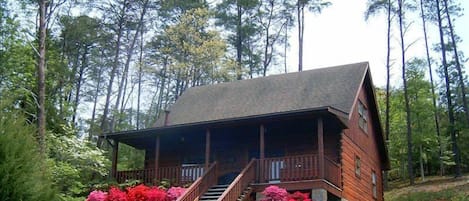 Front of Cabin.  Porch has Swing, 2 Rockers with cushions, Gas Grill and Hot-tub