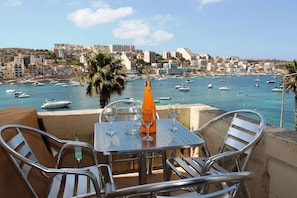 Terrace With Outdoor Furniture And Gas BBQ.