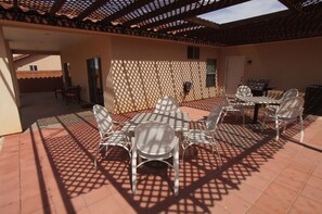 Backyard with tables and a grill to hangout and cook✨