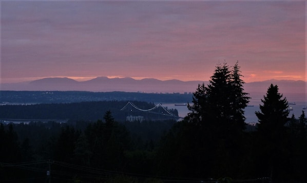 Our sunset view - Vancouver Island, Stanley Park, and the Lions Gate Bridge.   