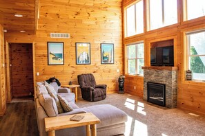 Large cozy couch and recliner; gas fire place.