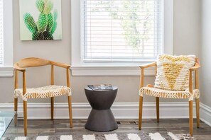 Every piece of furniture lends to the trendy ambiance of our inviting home, including this windowside scene.