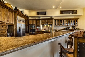 Kitchen is open to the living room, dining room and outdoor patio