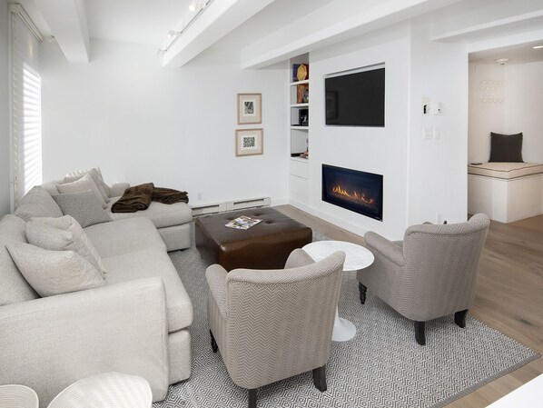 Living Room w/ Fireplace & TV