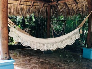 Relax & unwind in the poolside Rancho. Just beyond, is a Private tree/shower! 