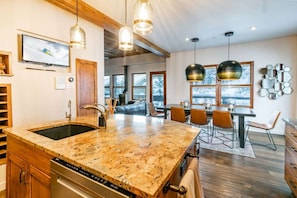 Lovely views of the trees and mountainside from kitchen. Or you can watch TV as you prepare. Outdoor deck features a BBQ Grill and table for Al Fresco dining.
