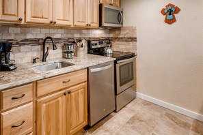 Fully remodeled and equipped kitchen with standard 12 cup coffee maker, cookware, flatware, and utensils