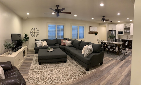 Open main living area. If needed, Queen blow-up mattress replaces ottoman.