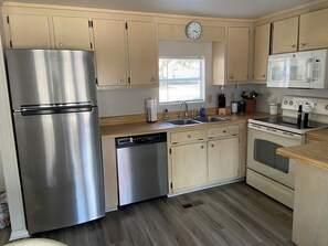Kitchen is fully equipped to cook and serve your meals.