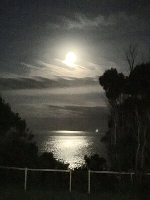 Moonlight over the ocean from upper deck, living room and main bedroom