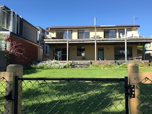 Two huge decks overlooking fully fenced yard to the ocean