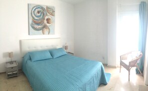 Master bedroom with kingsize bed, aircon & ensuite bathroom