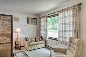 This 1-bedroom, 1-bath living space hosts cozy furnishings.