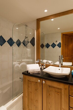Get ready for your day in the lovely bathroom.