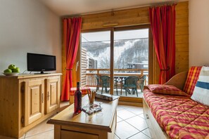 Sit back and relax in the cozy living area after a great day. (Views Vary).