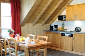 Loads of room at the dining table and the open concept is always nice for the cook.