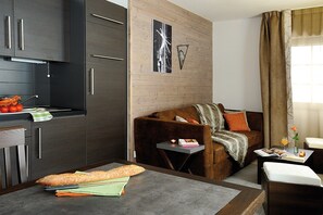 Kick back your feet and relax in the cozy living area.