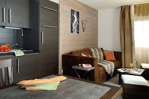 Kick back your feet and relax in the cozy living area.