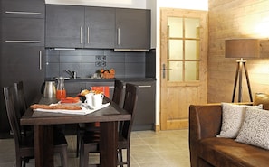 Prepare meals in the kitchenette and enjoy them at the dining table.