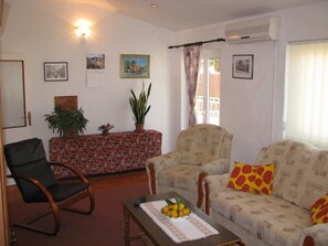 Living room, exit to balcony, own strong a/c unit  in living room.