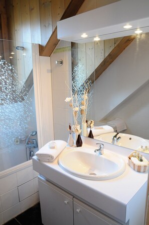 Get ready for the day ahead in the bright bathroom.