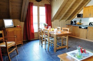 Loads of room at the dining table and the open concept is always nice for the cook.