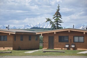 View of Tetons behind cabins