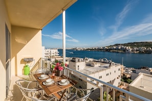 Sunny Terrace With Outdoor Furniture And Gas BBQ.  