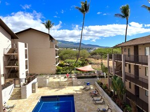View of the pool from the front door balcony
