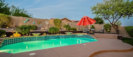 Heated pool and spa with water features.