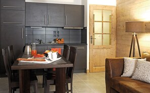 Prepare meals in the kitchenette and enjoy them at the dining table.