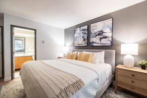 Primary bedroom: King bed, en-suite bathroom, balcony access, closet