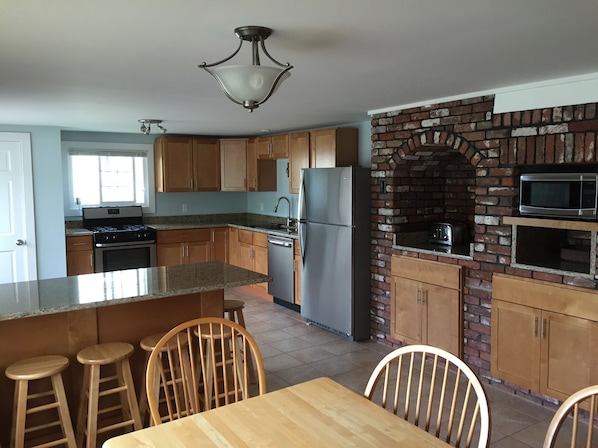 New kitchen with seating for 6 at breakfast bar and 6 at eat-in table