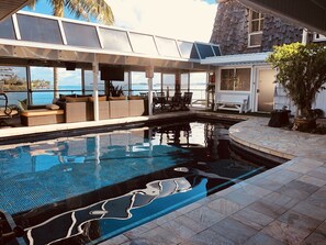 Bayview deck on main level w/ lounge and dining area adjacent to salt water pool