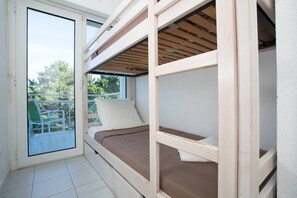 The sleeping alcove contains a cozy Bunk bed.