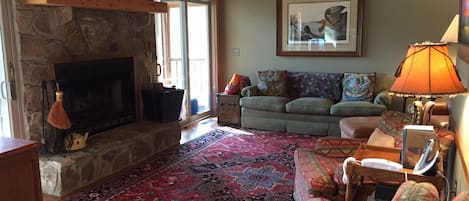 Living Room on the main floor with wood burning fireplace (firewood provided)