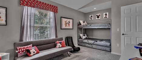 The Classic Mickey bunk room sleeps 4 in the triple bunk bed and fold-out futon