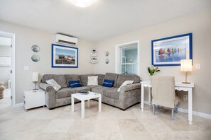 Family Room with oversized, comfy sectional and Flat Screen TV.