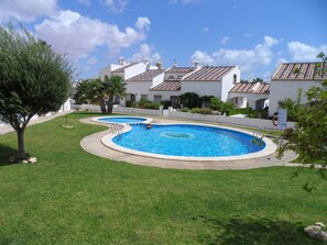 One of two communal pools, both a short walk from villa