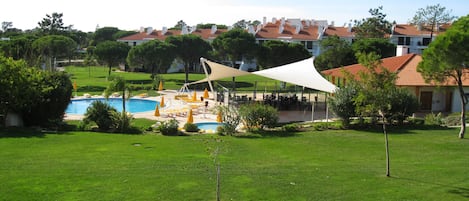 View from the Master Bedroom over looking the pools and gardens 