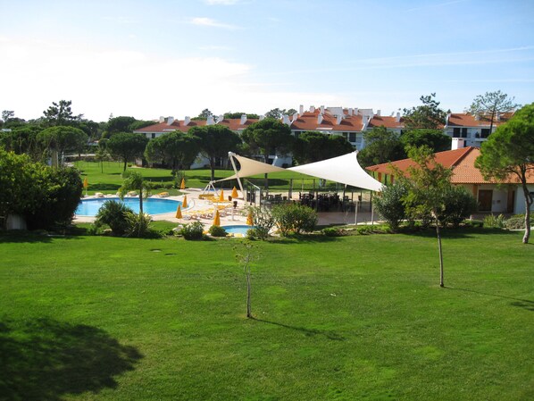 View from the Master Bedroom over looking the pools and gardens 